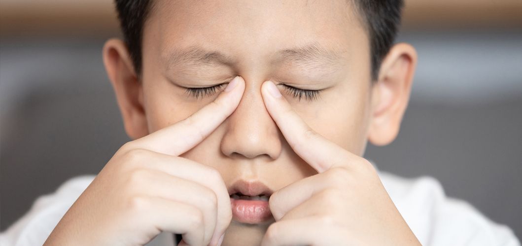 A boy suffering from allergic rhinitis.