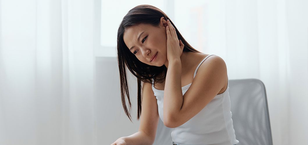 A woman suffering from an ear infection