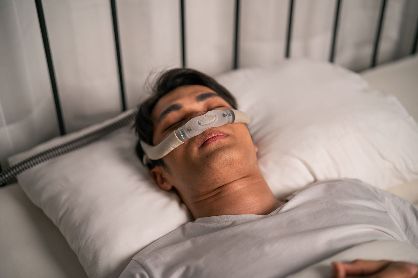 A man using a CPAP machine for sleep apnea